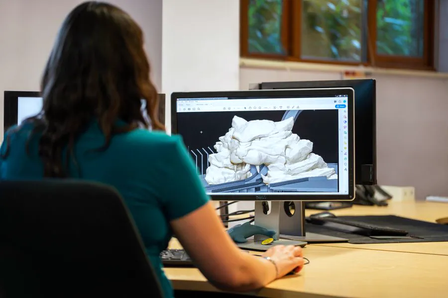 Designer building a 3D model in CAD software