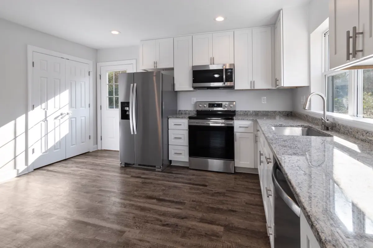 Newly remodeled modern kitchen with stainless appliances and granite countertops