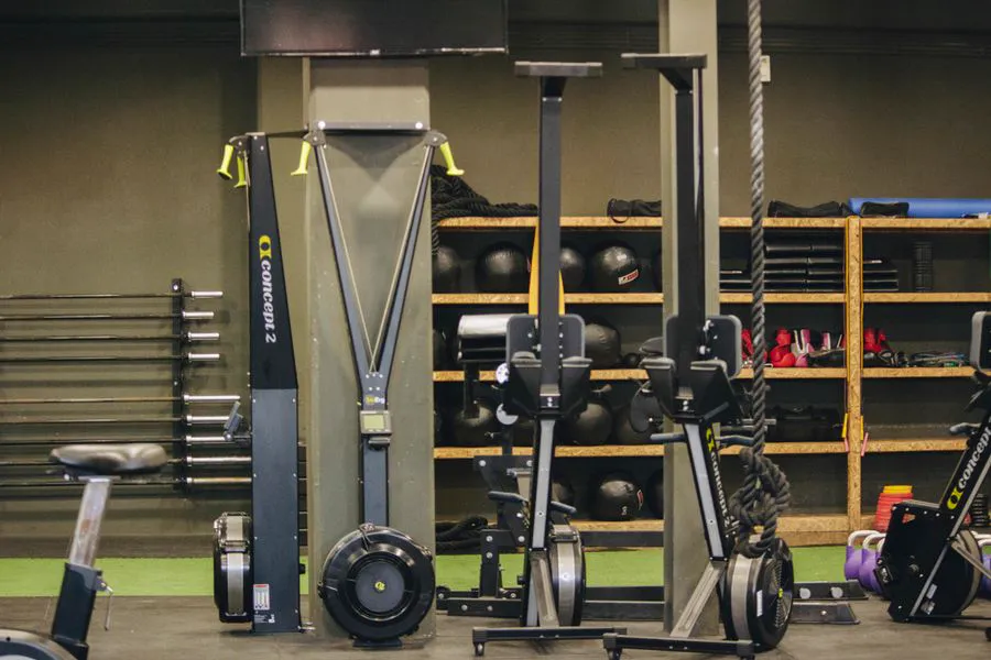 Functional training rig with weights, ropes and cardio machines